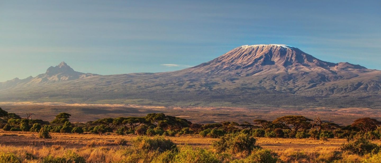 arid dry African savanna in late evening with Mount Kilimanjaro, highest peak i Africa. Amboseli National Park, Kenya
